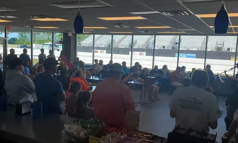 Indoor audience overlooking race track