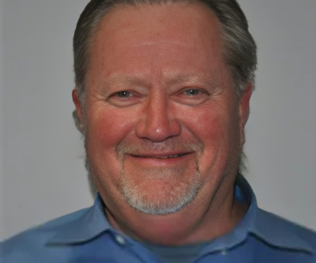 Smiling man in a blue shirt