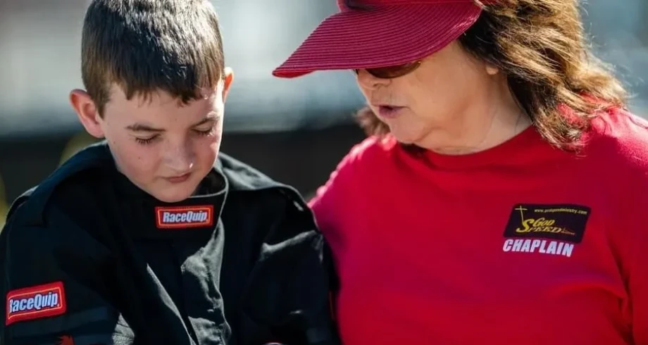 Racing chaplain with young racer